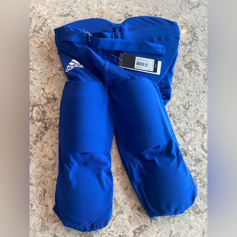Adidas blue football pants with pads. Size S. Never before worn. Tag still on.